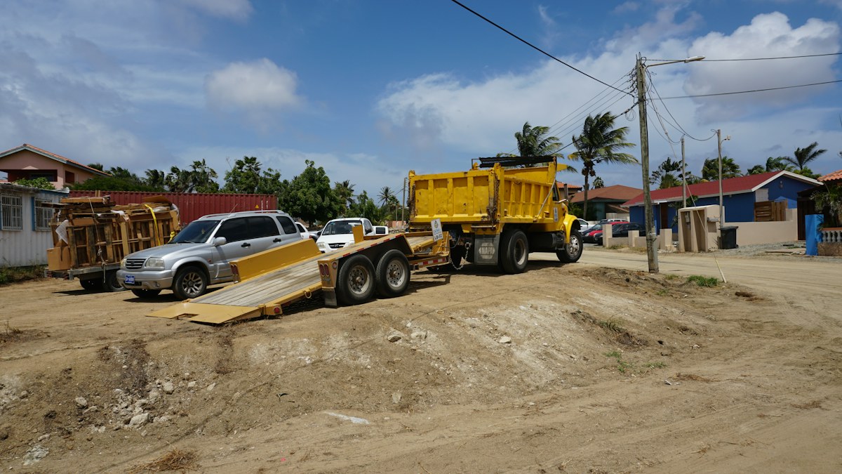 Heavy truck towing an equipment trailer
